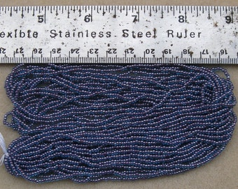 Czech Jablonex Ornela Preciosa seed beads, blue, lined with purple, 11/0, full hank, temporarily strung