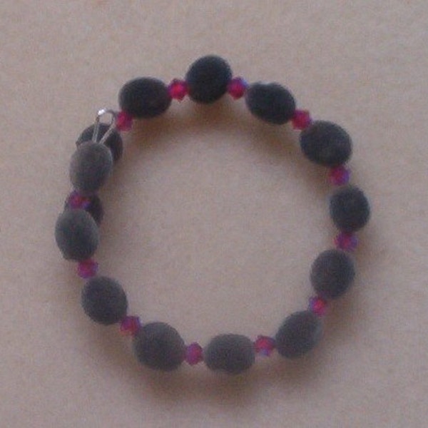 Hawaiian mgambo seed bracelet with 4mm light siam 2AB Swarovski crystal (dark pink), handmade in Hilo, Hawaii