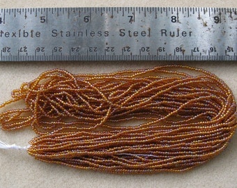 Czech Jablonex Ornela Preciosa seed beads, topaz AB, 11/0, full hank