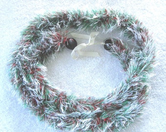 White, red and green eyelash lei, finished with black kukui nuts