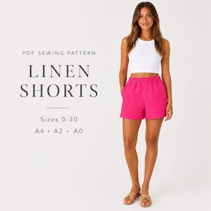 May include: A PDF sewing pattern for linen shorts with text reading PDF SEWING PATTERN LINEN SHORTS Sizes 0-30 A4 A2 A0. The shorts are bright pink with an elastic waistband and a relaxed fit, paired with a white sleeveless tank top.