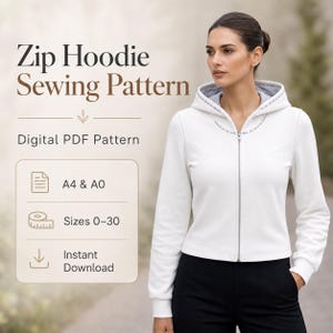 Può includere: Una felpa bianca con zip, maniche lunghe e cappuccio, con il testo Zip Hoodie Sewing Pattern, Digital PDF Pattern, A4 & A0, Sizes 0-30 e Instant Download. La felpa presenta una cerniera argentata e una fodera grigia all'interno del cappuccio.