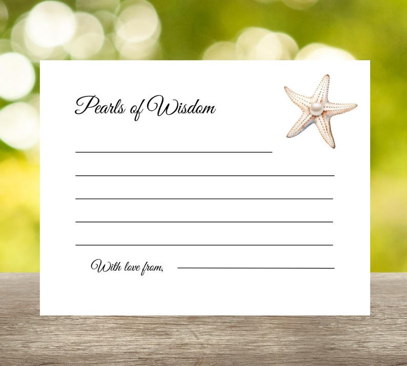 May include: A white card with the text "Pearls of Wisdom" and "With love from," printed in elegant script. A starfish with a pearl in the center is in the upper right corner. The card has lines for writing and is set against a blurred green background.