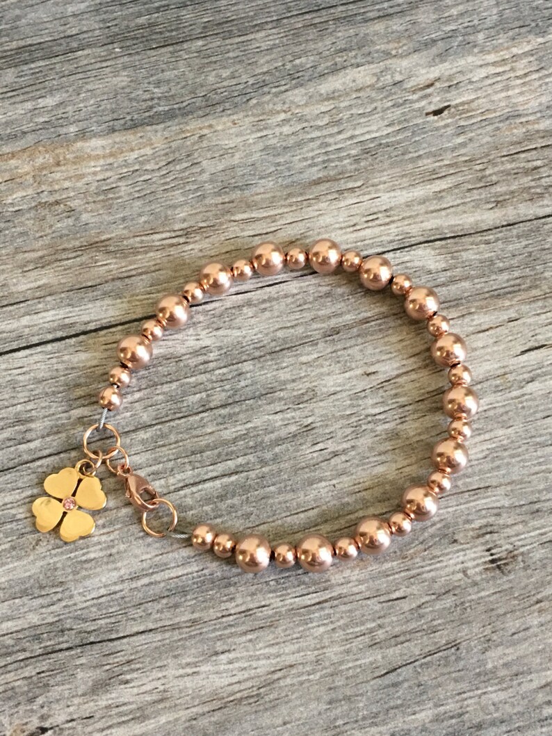 Rose Gold beaded bracelet with gold four leaf clover charm Etsy