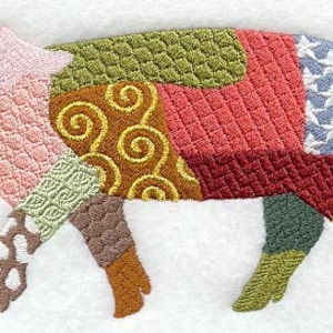 May include: A patchwork pig with a pink face and a curly tail. The pig is made of different colored fabrics with various patterns, including swirls, stars, and checkered designs.