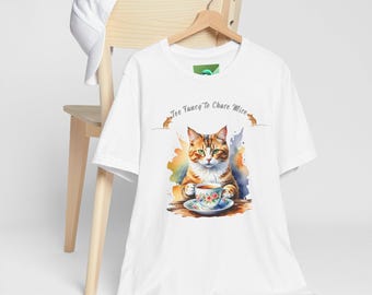 May include: White t-shirt featuring a watercolor illustration of a cat holding a teacup. The cat is orange, brown, and white, with green eyes. The text "Too Fancy to Chase Mice" is above the cat.