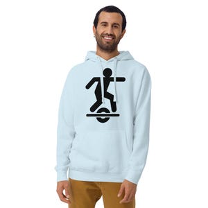 May include: Light blue hoodie with a black graphic of a person riding a one-wheel electric unicycle. The hoodie has a front pocket and a drawstring hood. The graphic is a simple, stylized illustration.