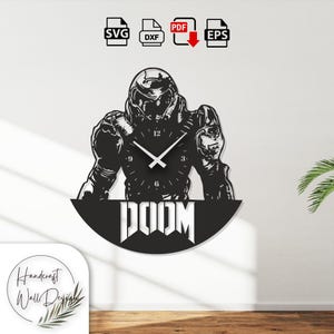 May include: Black wall clock featuring a stylized depiction of a character from the video game "Doom." The clock hands are white, and the word "DOOM" is displayed prominently below the character. Includes SVG, DXF, PDF, and EPS file icons.
