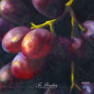 Detail of my modern grapes oil painting print on paper. This shows the brushstrokes of the bright green stems with red and purple fruit, emerging from the dark background. This is a reproduction of my realistic oil painting fruit still life.