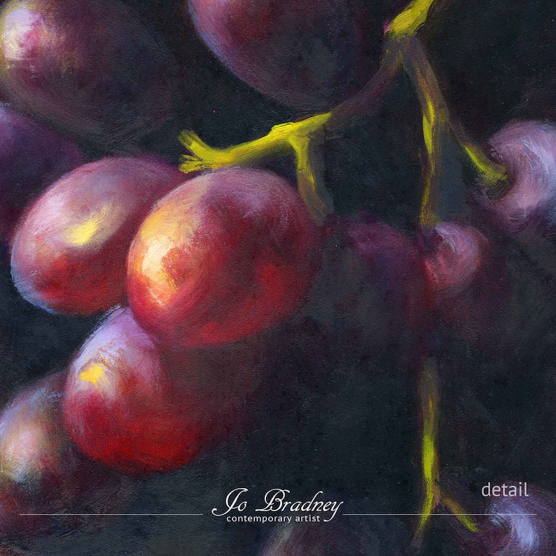 Detail of my modern grapes oil painting print on paper. This shows the brushstrokes of the bright green stems with red and purple fruit, emerging from the dark background. This is a reproduction of my realistic oil painting fruit still life.