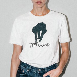 ¡Encuentra! Camiseta gráfica de diseño nostálgico: suave y ligera, unisex