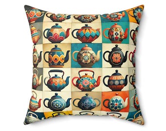 May include: A square throw pillow with a colorful pattern of 16 teapots. Each teapot is decorated with different geometric and floral designs in shades of blue, green, red, yellow, and orange.