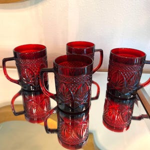 Vintage Cristal d&#39;Arques-Durand ruby my red mugs in the &quot;Antique&quot; pattern.  Set of 4