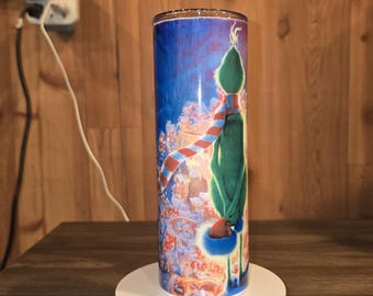 Grinch looking over whoville tumbler