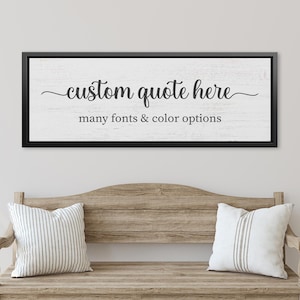 May include: A framed sign with the text "custom quote here" in elegant script, with "many fonts & color options" below. The sign is above a wooden bench with two striped pillows.