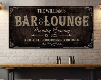May include: A rectangular wooden sign with the text "THE WILLIAM'S BAR & LOUNGE" in a vintage style. The sign also includes the text "Proudly Serving EST. 2023" and "GOOD PEOPLE GOOD DRINKS GOOD TIMES". The sign is mounted on a white brick wall.