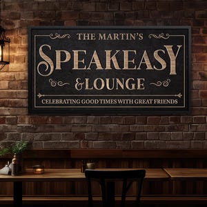 May include: A rectangular black wooden sign with the words "SPEAKEASY & LOUNGE" in a light wood color. The sign also includes the text "THE MARTIN'S" and "CELEBRATING GOOD TIMES WITH GREAT FRIENDS". The sign is mounted on a brick wall.