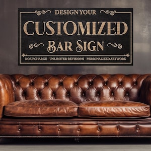 May include: A rectangular black wooden sign with the text "DESIGN YOUR CUSTOMIZED BAR SIGN" in a light brown, vintage font. The sign is above a brown leather couch.