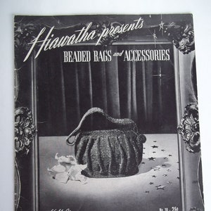 May include: Black and white image of a beaded bag with a star-shaped design. The bag is displayed on a table with a white flower in the foreground. The image is framed with a decorative border and includes the text "Hiawatha presents Beaded Bags and Accessories" and "No. 30 - 25c".