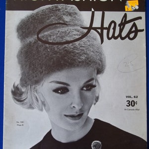 May include: A black and white magazine cover featuring a woman wearing a large, fluffy hat. The magazine is titled "High Fashion Hats" and is volume 62. The price is 30 cents.