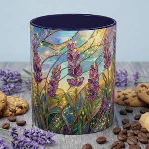May include: A ceramic mug with a stained-glass design featuring lavender sprigs in shades of purple and green against a gold and blue background. The mug has a dark blue interior and is surrounded by cookies, coffee beans, and lavender sprigs.
