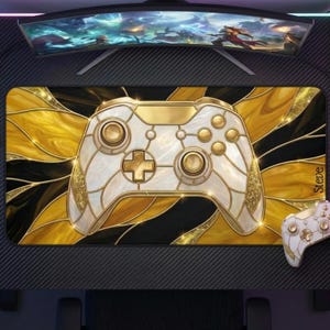 May include: A gaming mousepad featuring a stained-glass design with a white and gold controller. The pad has a black and gold background with a matching controller on the right. The word "Steve" is printed on the right side.