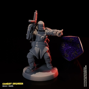 May include: A gray Combat Engineer miniature figure, holding a rifle and pointing. The figure is on a round base, with a large purple and black die in the background. Text at the bottom reads "COMBAT ENGINEER" and "32mm - Heroic".