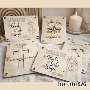 May include: A collection of laser-cut wooden plaques with religious themes. The plaques feature engraved text and illustrations, including a cross, a boat, and children. The text includes phrases like "Gottes Segen" and "Kommunion". The plaques are held together with small metal fasteners.