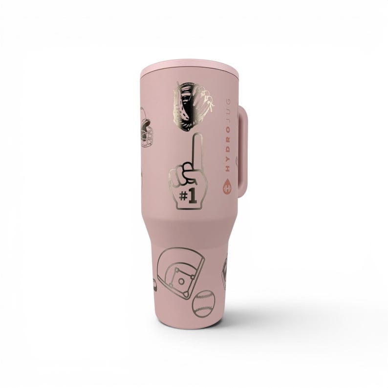 May include: A light pink insulated tumbler with a handle, featuring a repeating pattern of dark-colored baseball-themed graphics including a glove, a number one foam finger, a baseball, and a home plate, with the text HYDROJUG printed vertically.