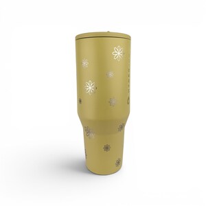 May include: A mustard yellow insulated tumbler with a tapered base and a flat lid. The exterior features a scattered pattern of small, silver-colored flower outlines and the vertical text "HYDRO JUG" printed in silver near the right side.