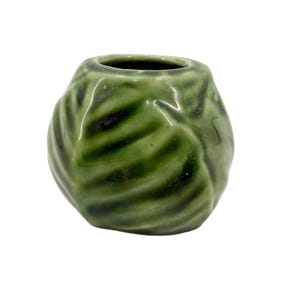 May include: A white ceramic mug with a black handle and the text "But First, Coffee" in a handwritten style. The mug is on a white surface. The mug is 4 inches tall.