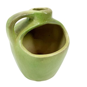 May include: A rustic wooden sign with the text "Welcome to our home" in white lettering. The sign features a distressed finish and a simple, inviting design, perfect for front door decor.