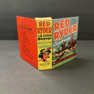 May include: A vintage "Red Ryder and Little Beaver on Hoofs of Thunder" book. The cover features illustrations of cowboys and Native Americans. The book is a "Better Little Books" edition with a red spine and a yellow and blue cover.