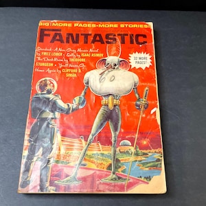 May include: Vintage "Fantastic" science fiction magazine cover. The cover features a retro illustration of an astronaut and a tall, robotic alien figure. The magazine's title is in large, red letters, with the issue's stories listed below.