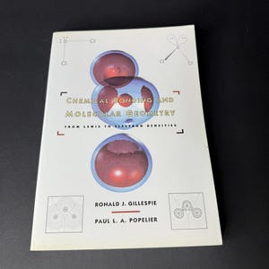 May include: A textbook titled "Chemical Bonding and Molecular Geometry" with a white cover. The cover features a graphic of molecular structures in shades of red and blue. The authors' names, Ronald J. Gillespie and Paul L. A. Popelier, are printed below.