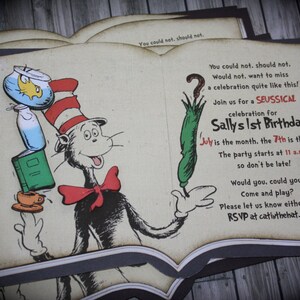 May include: A book-shaped invitation featuring a cartoon cat wearing a red bow tie and a hat. The invitation is for Sally's 1st birthday and includes the text "Join us for a Seussical celebration for Sally's 1st Birthday" and "July is the month, the 7th is the date... The party starts at 11 a.m. so don't be late! Would you, could you Come and play? Please let us know either way. RSVP at catinthehat.com"