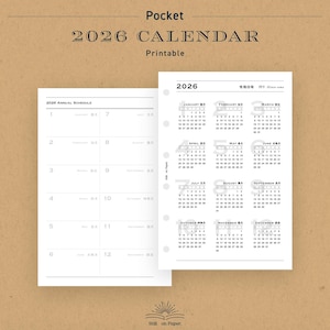 May include: A printable 2026 calendar with a pocket-sized design. The calendar features a white layout with monthly grids and an annual schedule. The text "2026 CALENDAR" is displayed at the top, with the word "Printable" below it.