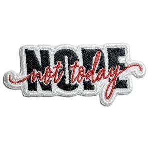 May include: White embroidered patch with the words "NOPE not today" in black and red lettering.