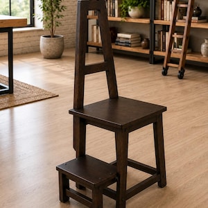 May include: A dark brown wooden library chair with a tall, open-frame backrest and a built-in, retractable step stool at the base. The piece features a square seat, four sturdy legs, and a lower platform that functions as a step for reaching heights.