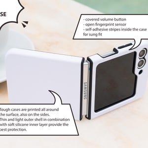 May include: White Z Flip tough case with black accents, featuring a covered volume button, open fingerprint sensor, and self-adhesive stripes. The case is designed for a sung fit and provides protection with a thin outer shell and soft silicone inner layer.