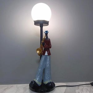 Unique red jazzman table lamp for music lovers