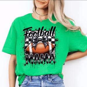 A irish green Football Mama graphic t shirt featuring a stylish football design with a checkered pattern and a bow.