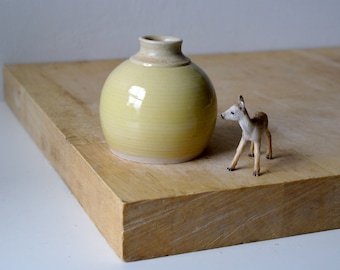 Hand thrown stoneware round bottle vase with bright yellow glaze