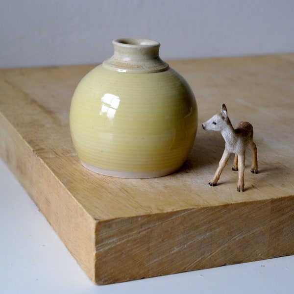 Hand thrown stoneware round bottle vase with bright yellow glaze