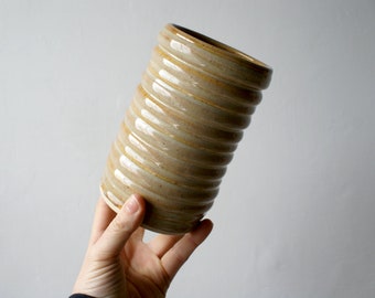 Textural tube shaped vase glazed in grey