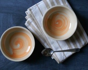 Set of two snack bowls in simply clay with orange brushstroke decoration