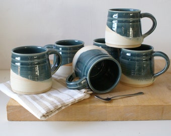 One large pottery tea mug in two tone blue and cream colours