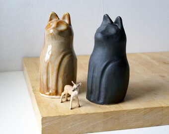 Handmade pottery cat ornament with upright seated design in glossy grey or matte black