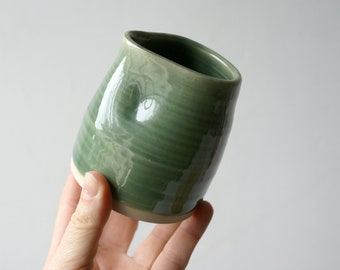 Hand thrown small stoneware milk jug with glossy green glaze