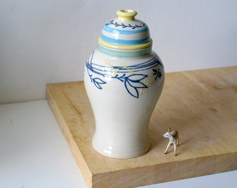 Tall floral motif slip trailed ginger jar in blues and yellow